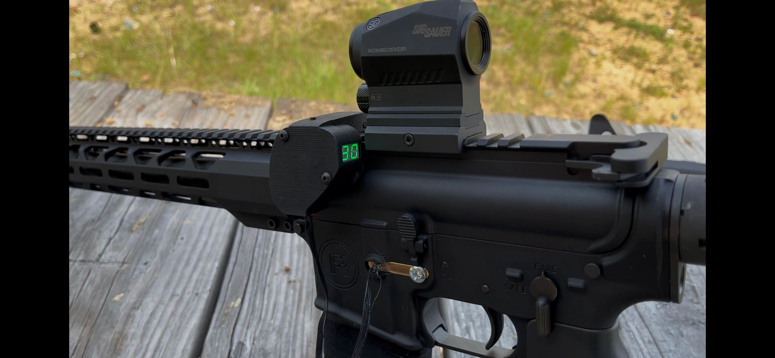Live FEED display mounted on an AR-15 rail showing a round count of 30